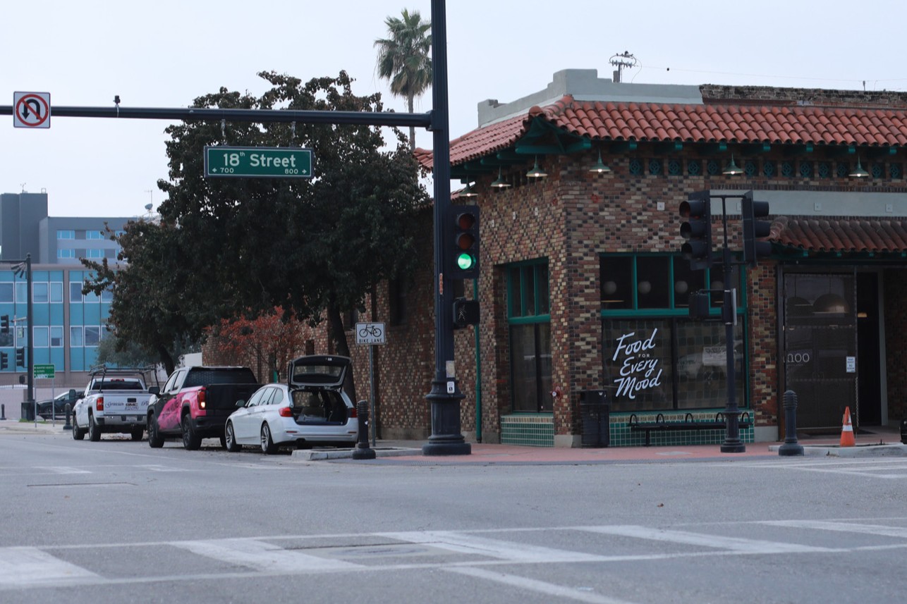 Bike Lane near the intersection of 18th Street and Q Street exposed to parked cars.